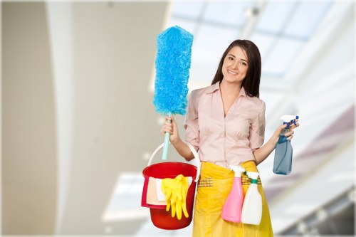 Professional carpet cleaner working safely with insured equipment